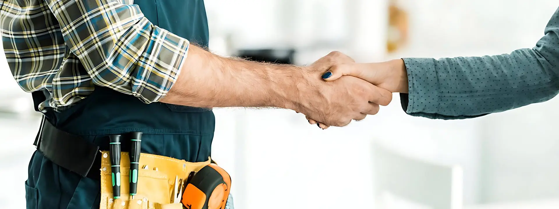 A man shaking hands with another person.